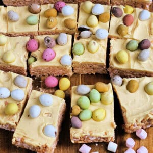 Rice Krispie squares with white chocolate layer and mini eggs.