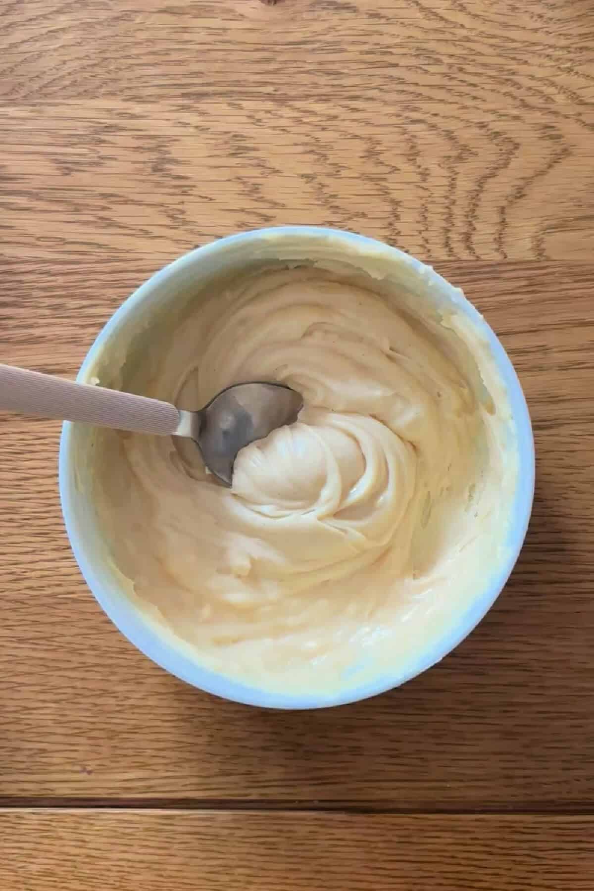 Melted white chocolate in a bowl.
