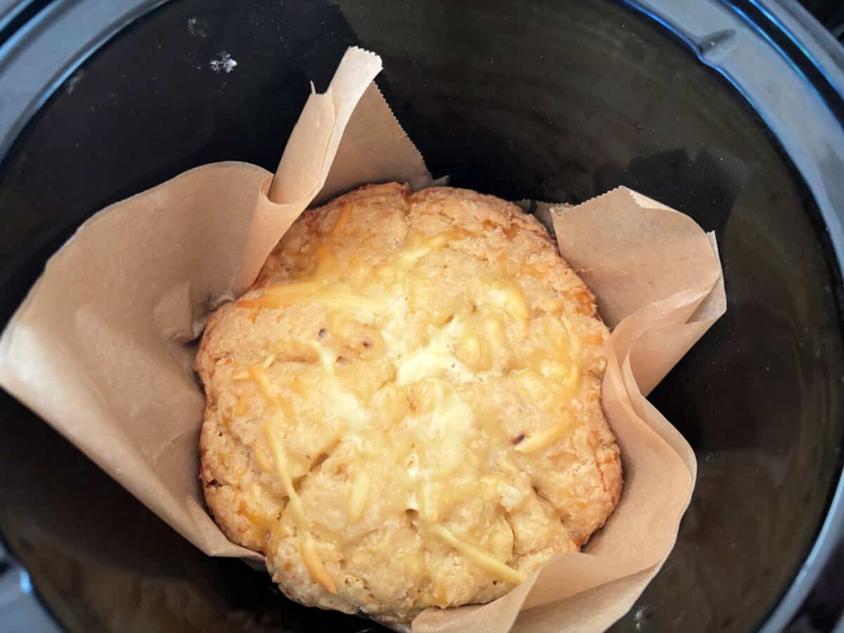 Cooked cheese scones in the slow cooker pot.