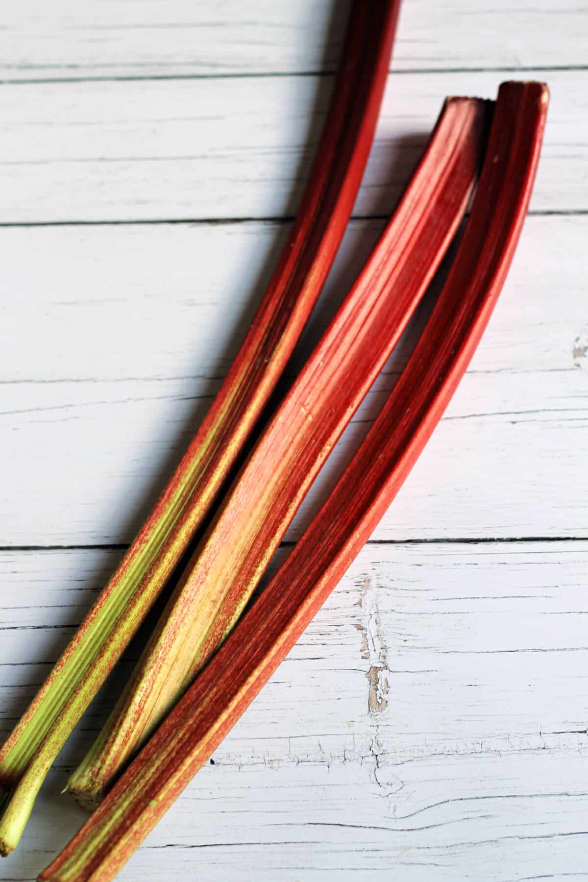 Rhubarb stalks on a white table.