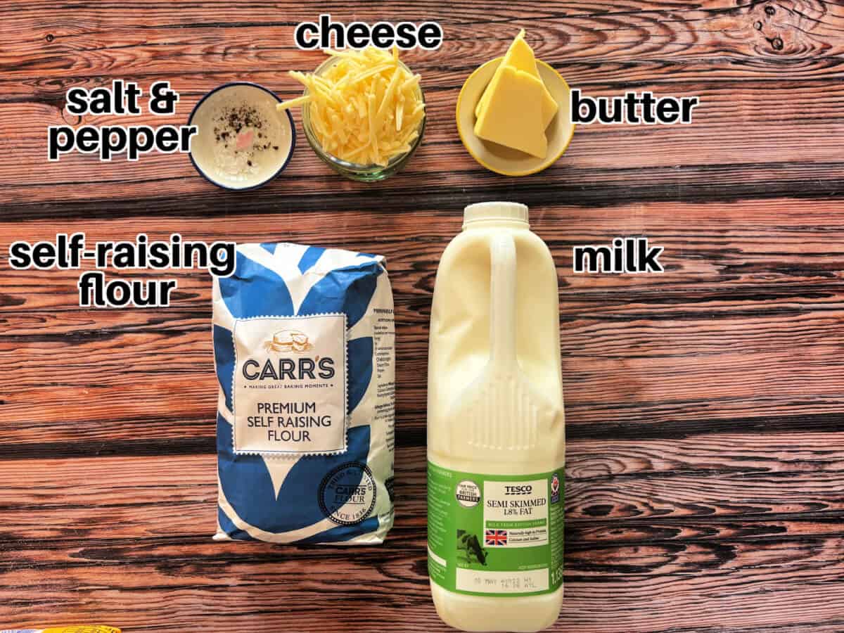 Labelled ingredients for cheese scones on wooden table.